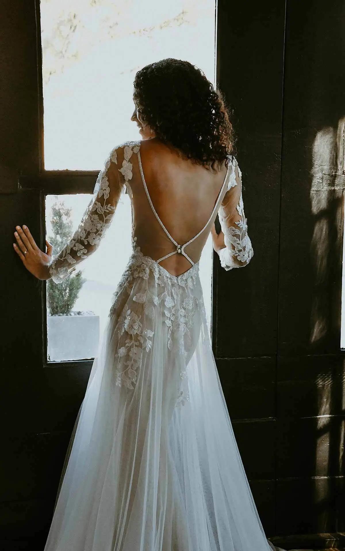 Long-Sleeved Wedding Dress with Open-Back by Stella York. Desktop Image